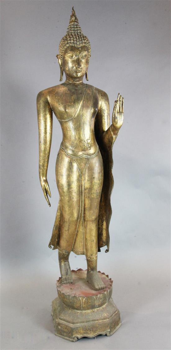 A large Thai gilt bronze standing figure of Buddha, possibly Mandalay period, 19th century, height 193.5cm